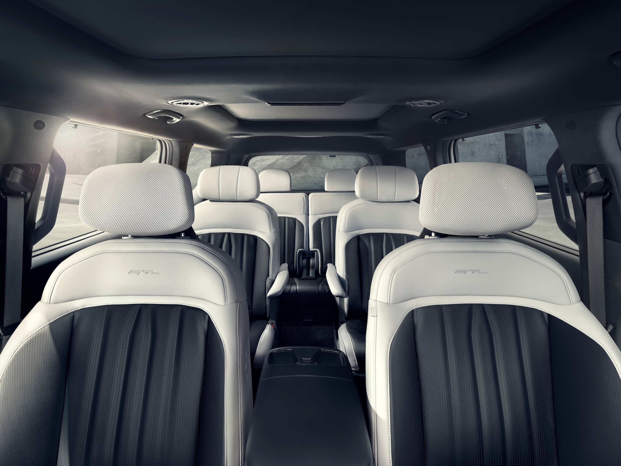 Full Kia EV9 cabin showing five passenger seats behind the driver position